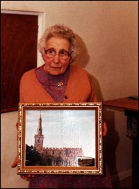 With her gift - a painting of the Church