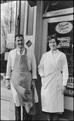 Photograph of Cliffe & Eileen Iliffe outside the shop in 1958