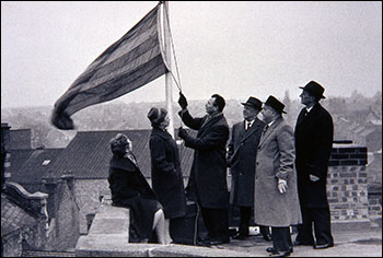 Raising the flag on the Office building