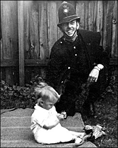 Arthur Evans in his uniform with his daughter in 1947