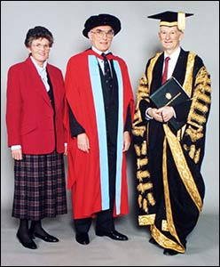 Brian (centre), with his wife Sonia and Lord Dearing