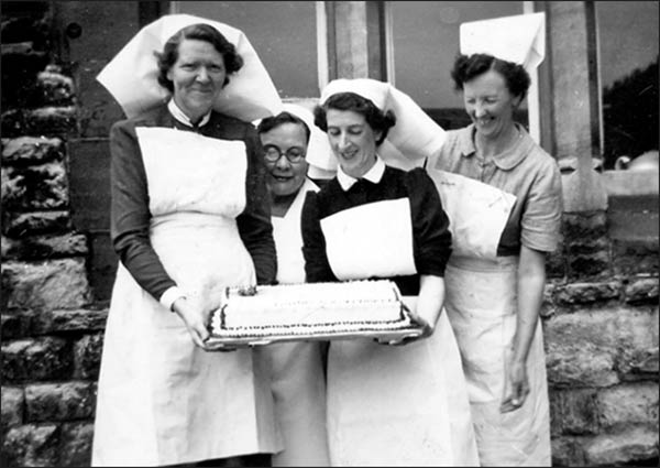 Staff with cake for Coronation 1953