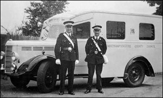 Cliff Iliffe and Bill Houghton with an ambulance
