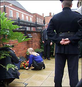 One of the children laying a wreath