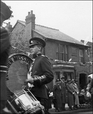 Photograph of Gordon Scholes, drummer, Marching in Brookfield Road1930s