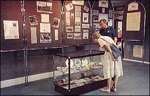 Visitors looking at one of the showcases