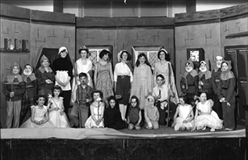 Photograph showing the cast of Snow White and the Seven Dwarves.  Sue is on the extreme right