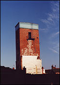 Photograph by Peter Danby showing the tower, with the water tank on top, prior to being demolished
