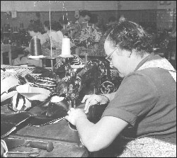 Picture of a woman working on a closing machine