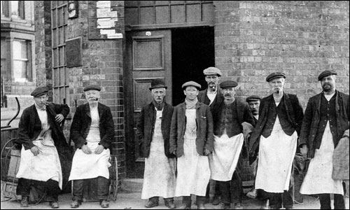 Workers outside the factory