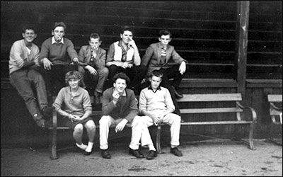 teenagers in front of old stand