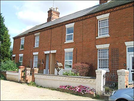 Note the decorative wall in front of these cottages