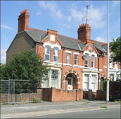 A pair of houses - note the entry to the backway between the next pair