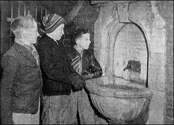 boys looking at the memorial