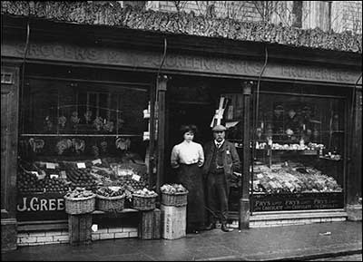 Daughter Flo Green with her father Joe outside their shop in High Street, Rushden.