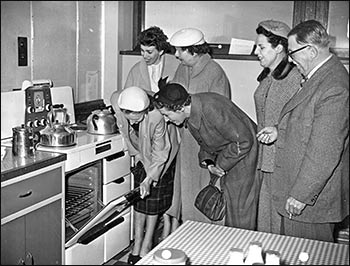 ladies inspect the kitchens