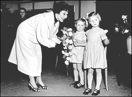 Photograph showing Jane Griffiths accepting the bouquet