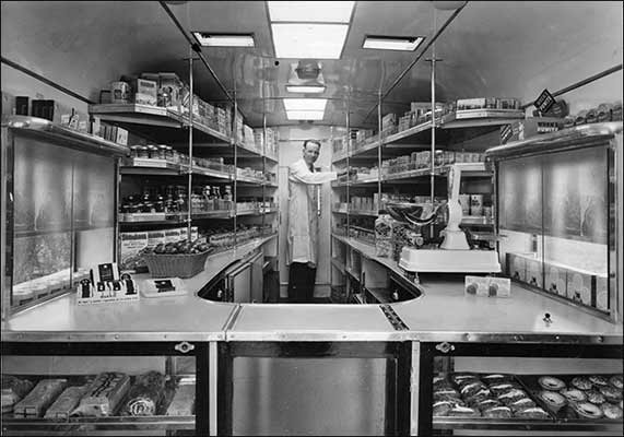 Mr A Bradshaw inside the mobile shop