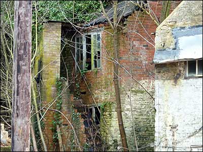 Cottage behing the roadside properties