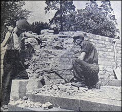 the two men removing the wall