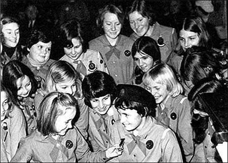 Daphne's friends look at her medal