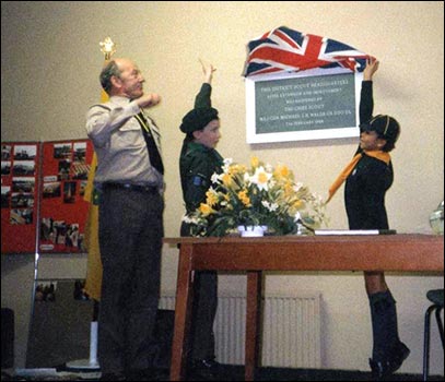 Chief Scout is assisted with the unveiling
