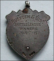 The inscription on the badge