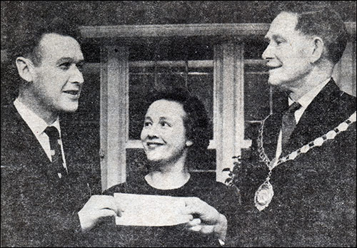 Dr Smith presents the cheque