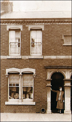 Edith in the doorway of 39 Midland Road