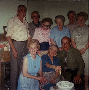 Nellie celebrating her birthday, daughter Vera and son Gordon by her side