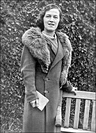 Picture of Nancy Hopkins in her royal blue coat with silver fox fur collar from Wills.