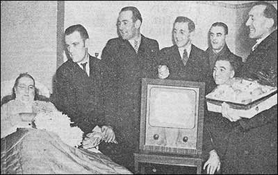 Postmen giving the TV