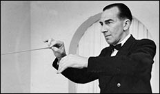William Scholes conducting a band