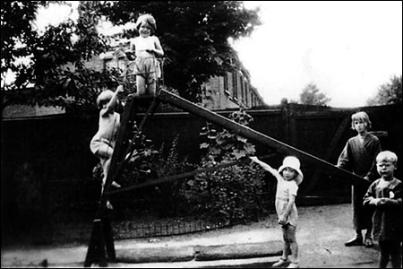 Daisy climbing the steps of the slide ina playground in Walthamstow