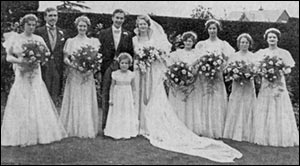 Photo of the wedding group posing after the ceremony