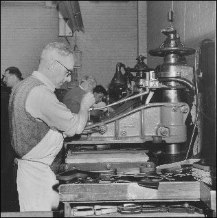 The clicking press with some of the press knives in the foreground