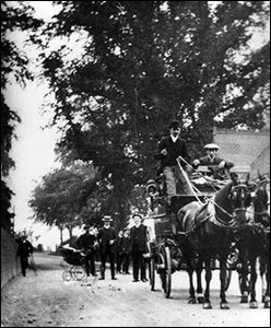 An open carriage with the black horses