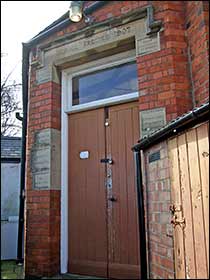 The school entrance behind the church