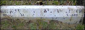 The kerbstone on his parents' grave